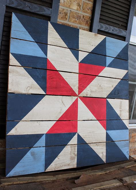 barn quilts for a tan and green metal house|barn quilt designs.